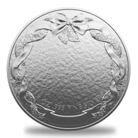 Reverse side of the 1 oz SANTA GIFTS Silver Round by OZ Mint, showcasing an elegant holiday wreath with a bow and .999 fine silver purity mark.