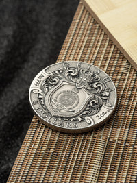 Silver dollar coin with intricate designs on a textured surface