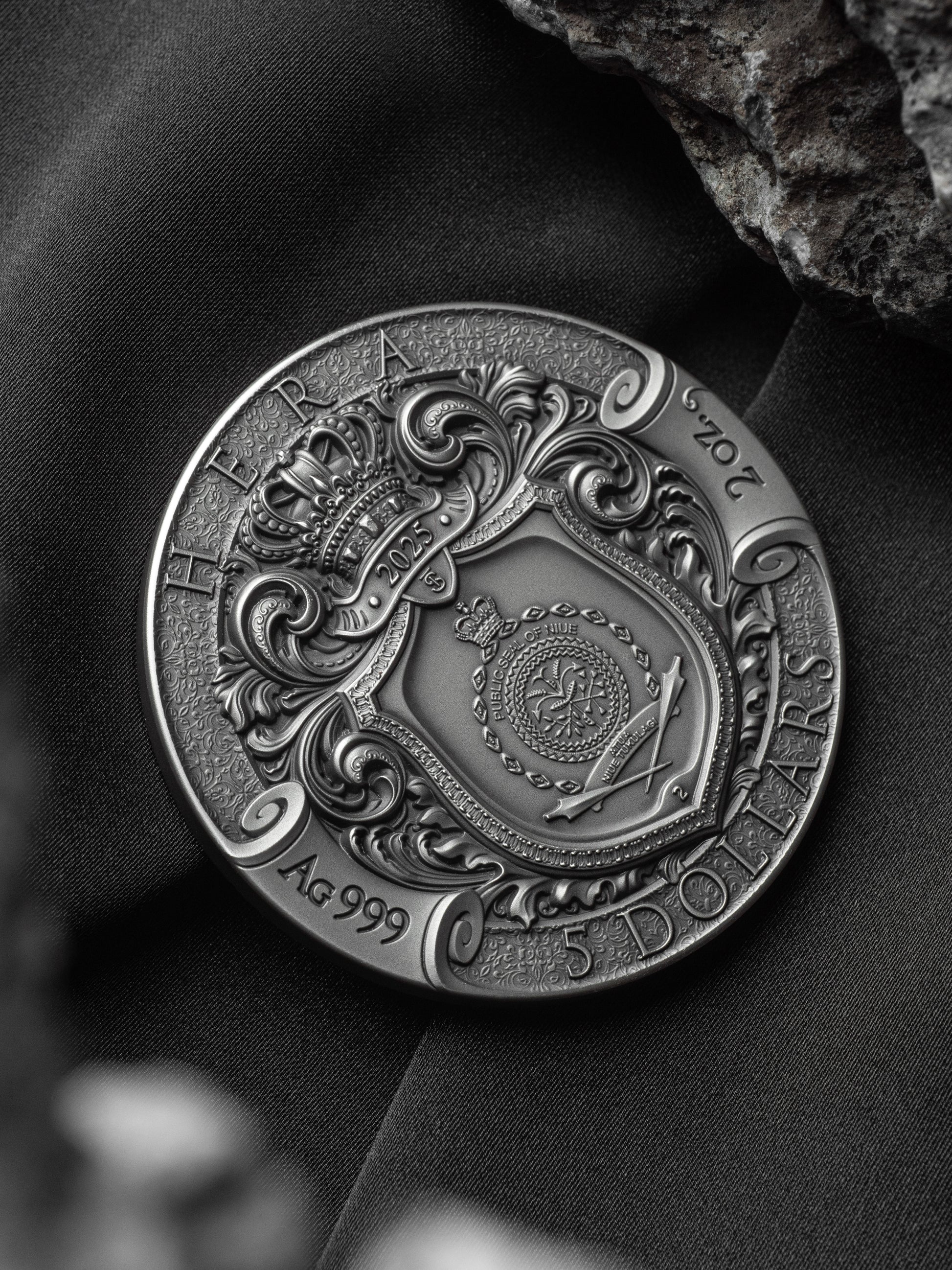 Decorative coin with intricate designs on a dark background