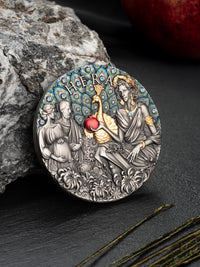 Decorative coin with classical design on a dark surface