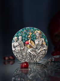 Decorative plaque with classical design featuring figures and peacock, on a dark background.