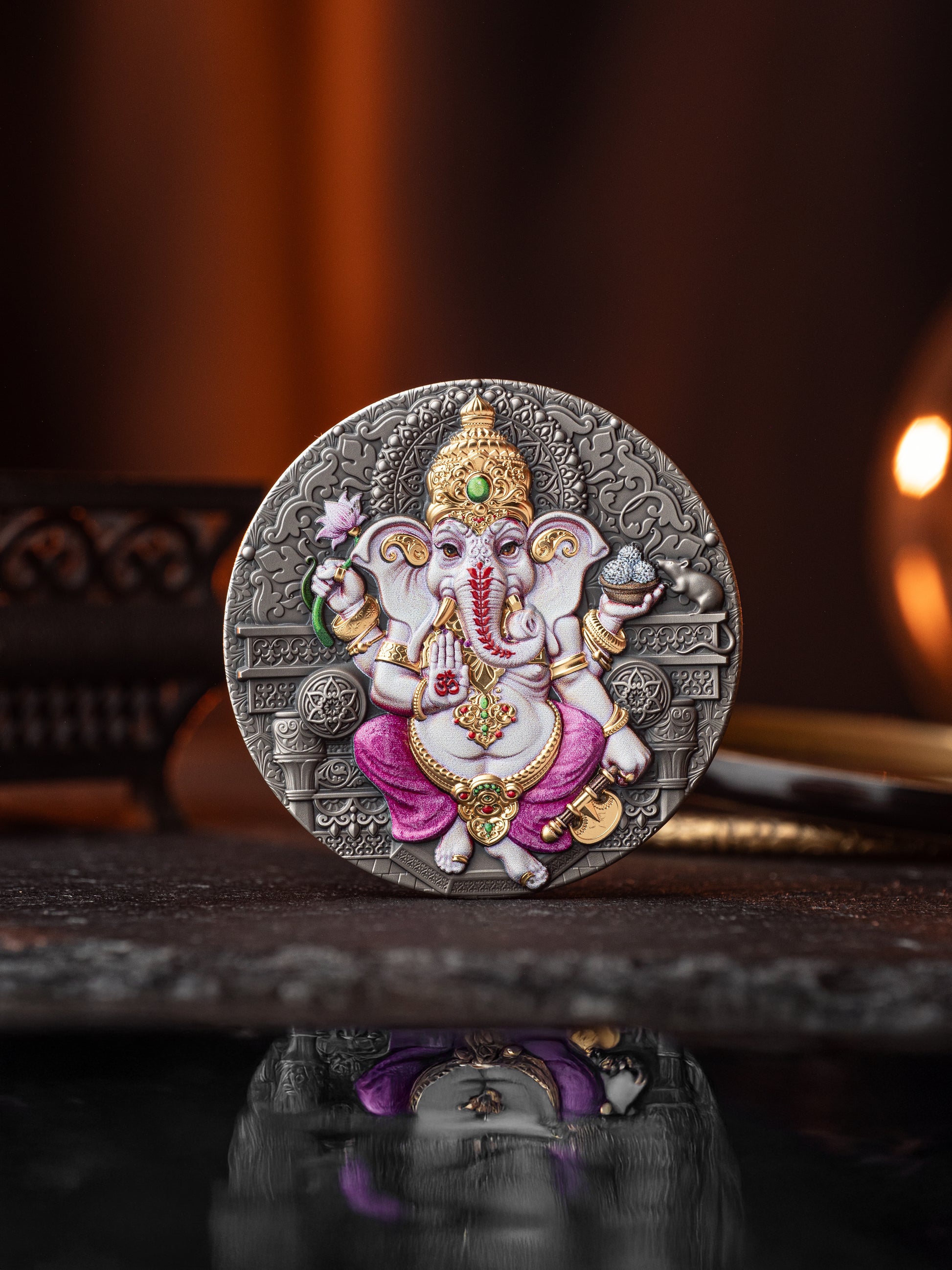 Decorative coin with an illustration of a deity on a reflective surface.