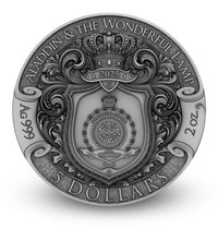 Silver coin featuring intricate designs and text, likely related to 'Aladdin & The Wonderful Lamp'.