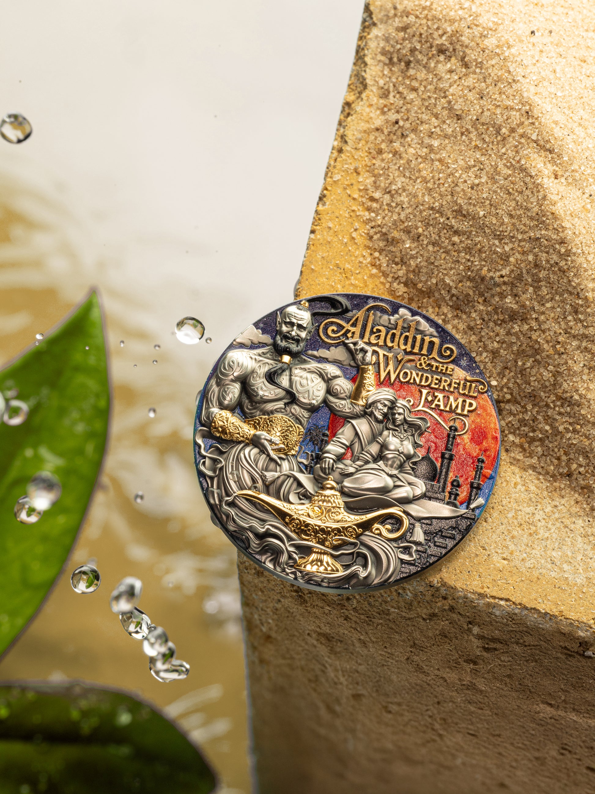 Decorative coin featuring 'Aladdin and the Wonderful Lamp' design on a textured surface with water droplets.