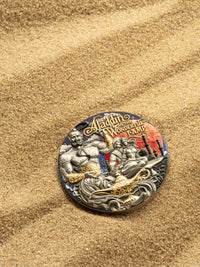 Decorative coin with characters from 'Aladdin and the Magic Lamp' on a sandy background