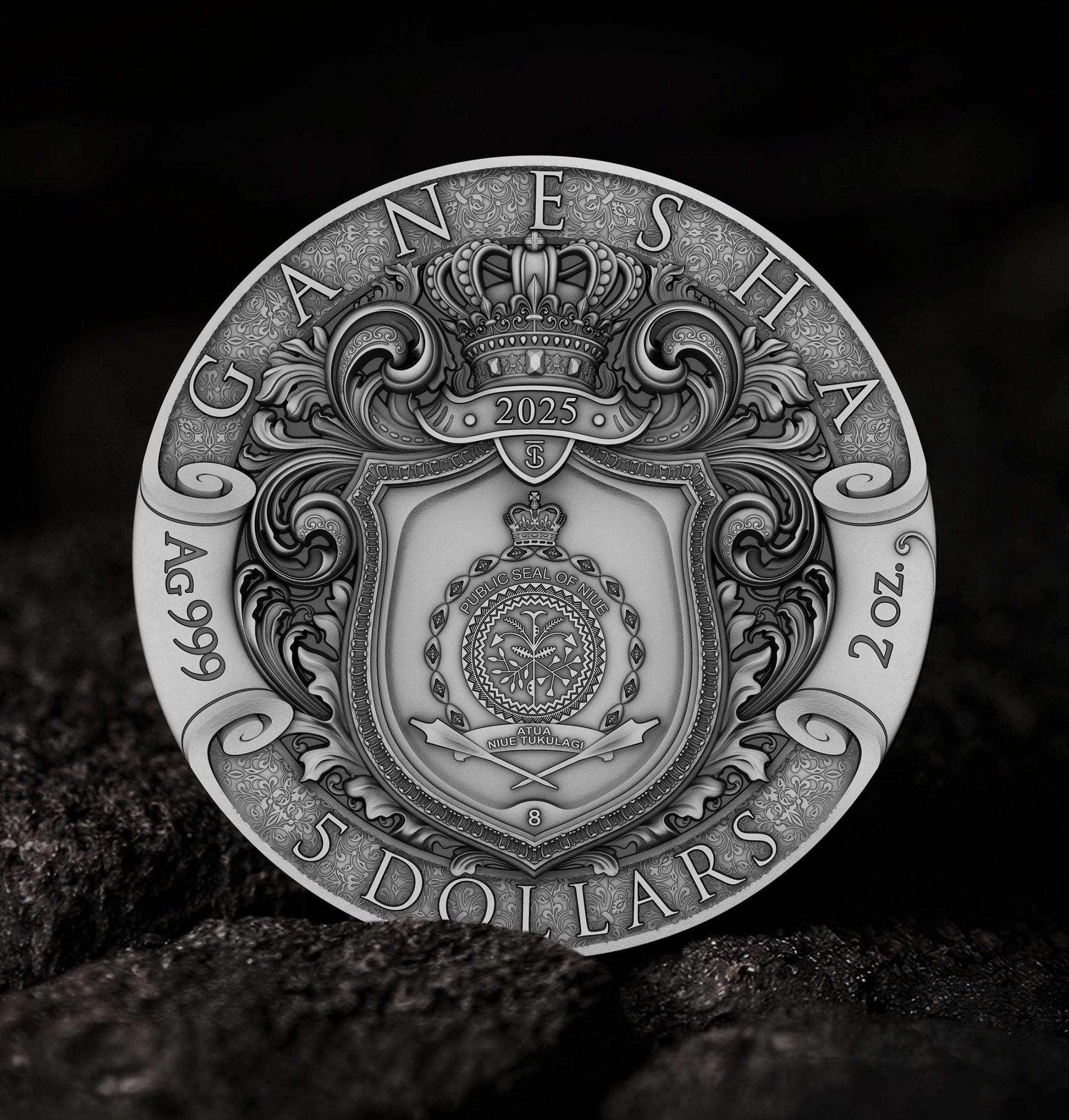Silver coin with intricate designs and text on a dark background
