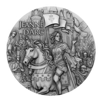 Circular coin featuring an illustration of Joan of Arc with a horse, surrounded by soldiers and a castle.
