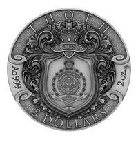 Silver coin with intricate design and text on a white background