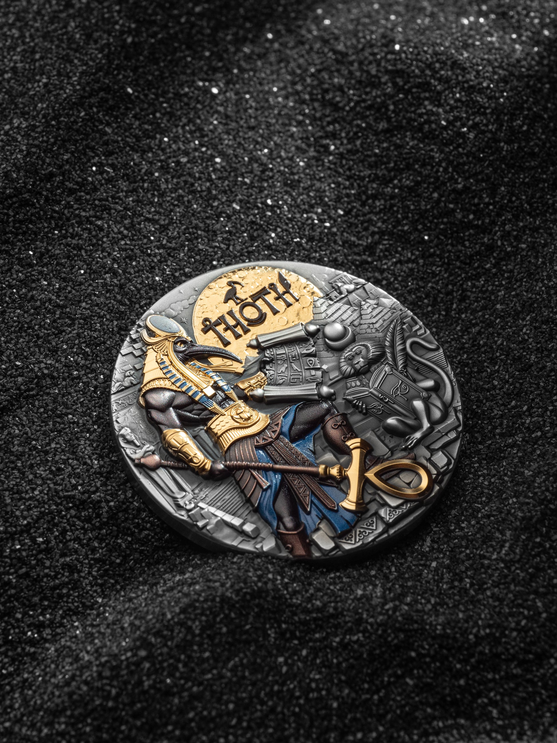 Decorative coin with detailed design on a dark textured background