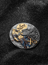 Decorative coin with detailed design on a dark textured background