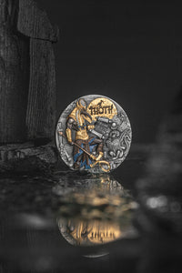 Decorative coin with a reflective surface on a dark background