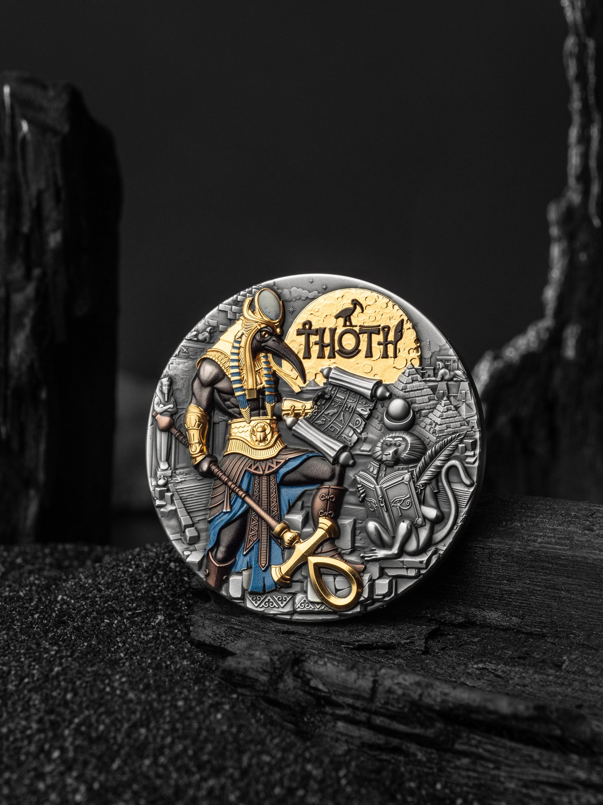 Decorative coin featuring an Egyptian god on a dark textured surface