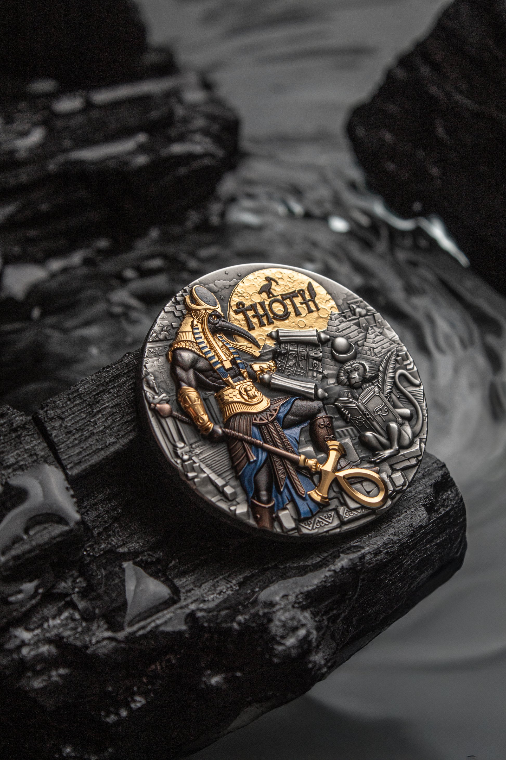 Decorative coin with a warrior design on a dark stone surface